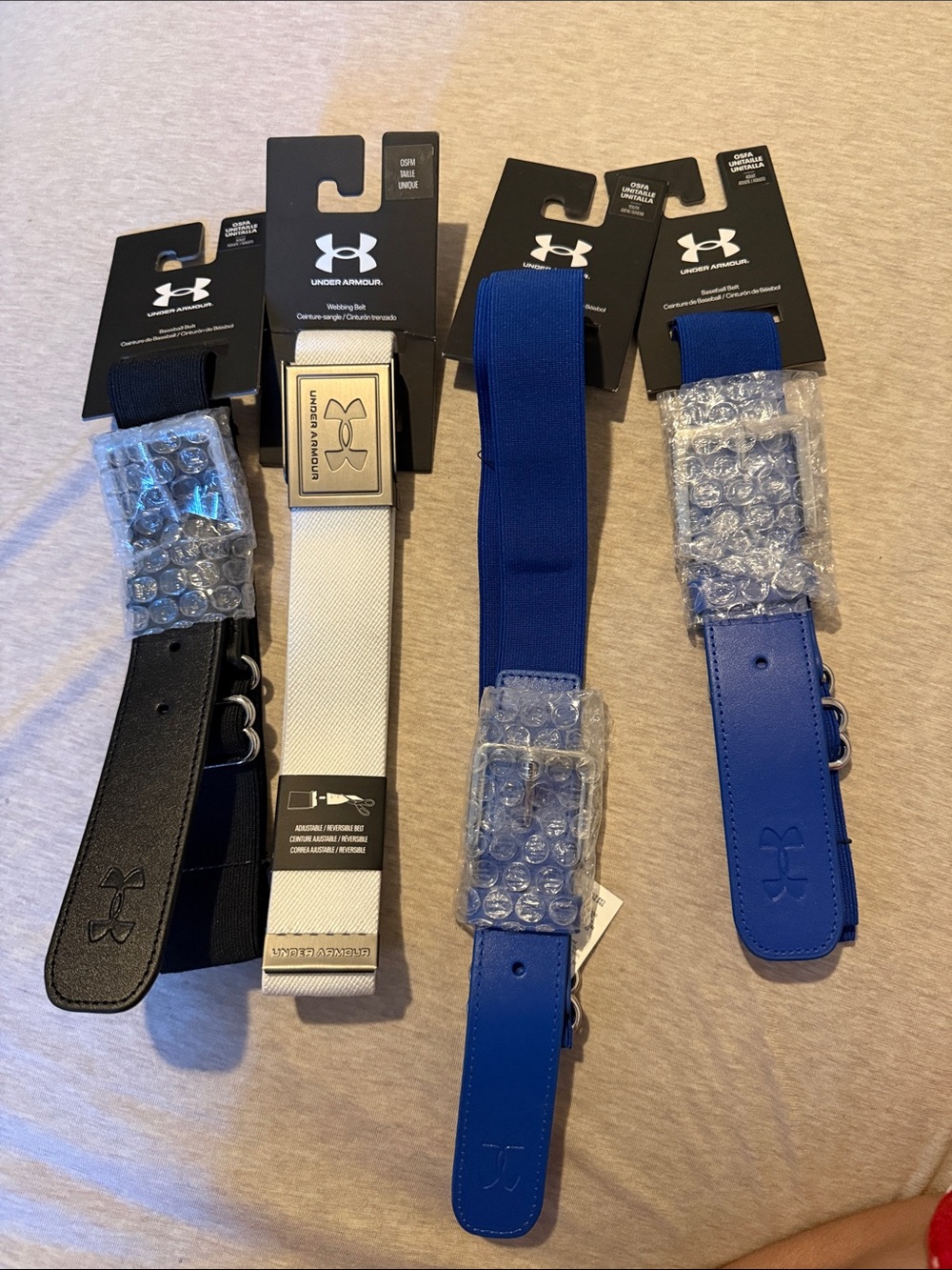 Under Armour baseball Belts — Black, White, Blue (4 pack)